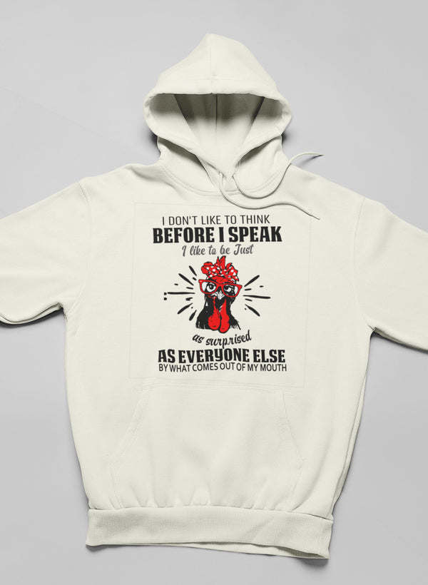 Off-white hoodie with front slogan print and red cartoon face graphic