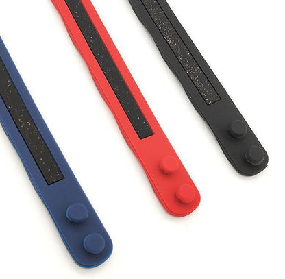 Anti-static bracelet close-up in blue, red, and black with dark textured stripes