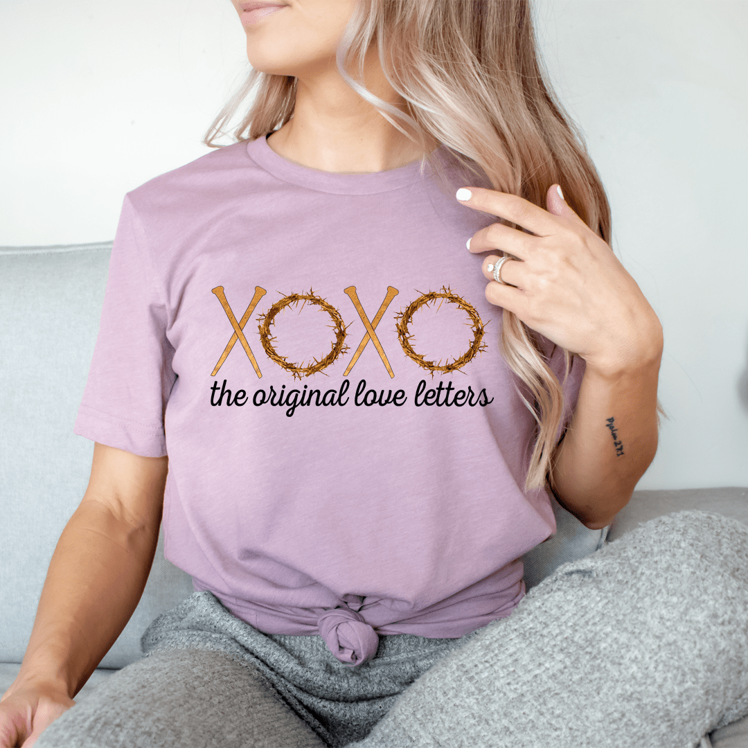 Lavender/purple T-shirt with XOXO graphic and “the original love letters” text