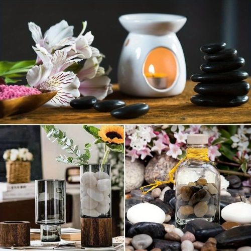 Polished black river rocks as decorative filler for candle and floral spa display