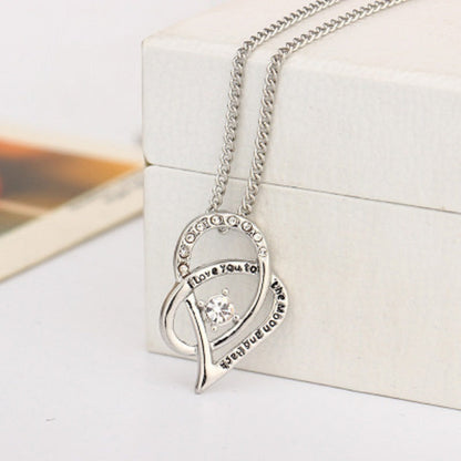Sterling silver heart pendant necklace with clear cubic zirconia and round pavé stones