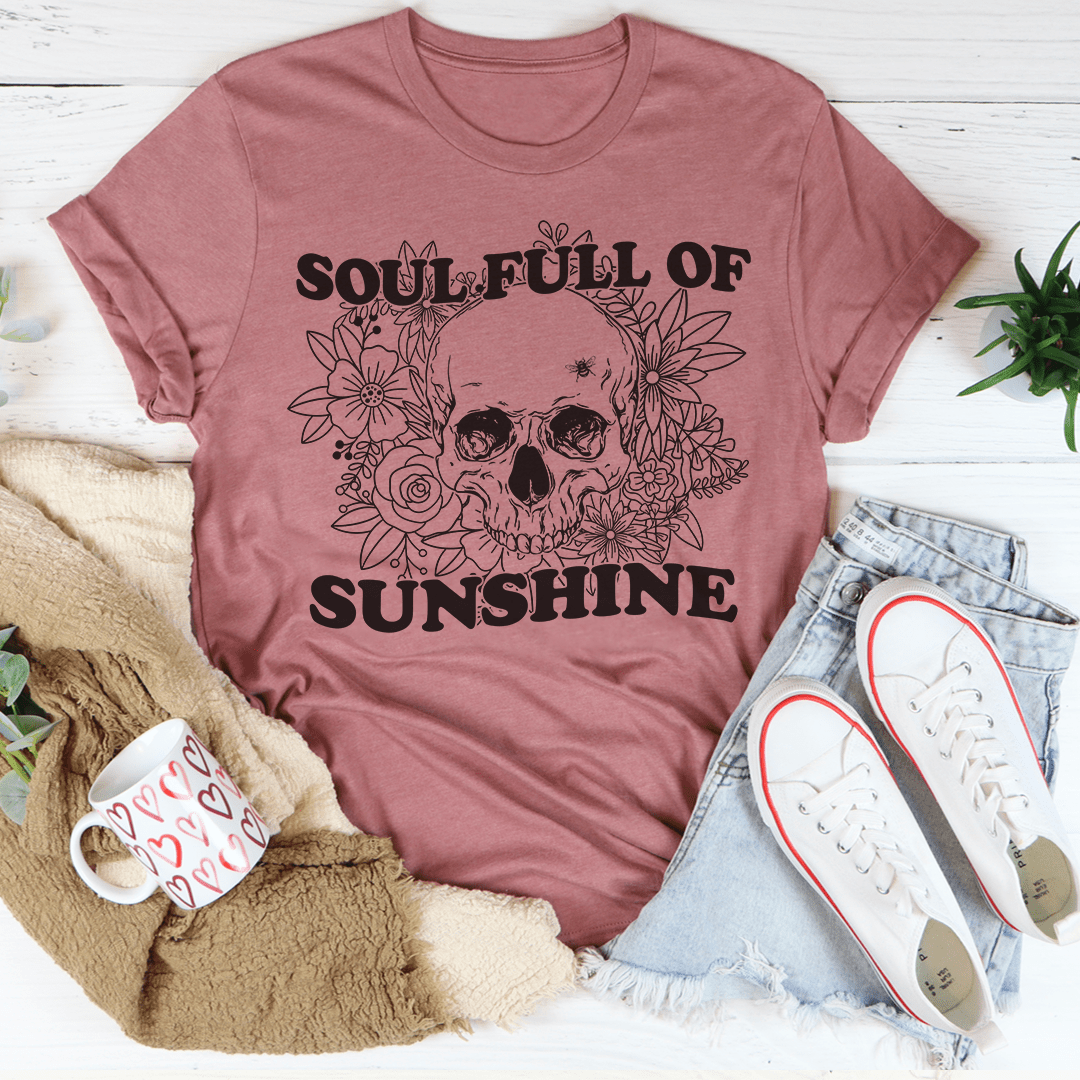 Mauve pink T-shirt with skull and floral wreath graphic, crew neck.