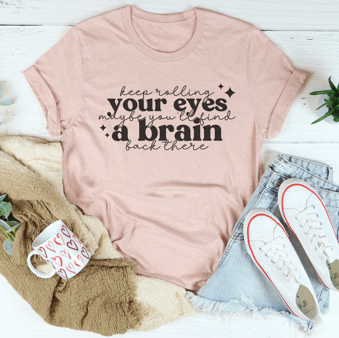 Light mauve short-sleeve T-shirt with centered white typographic slogan graphic