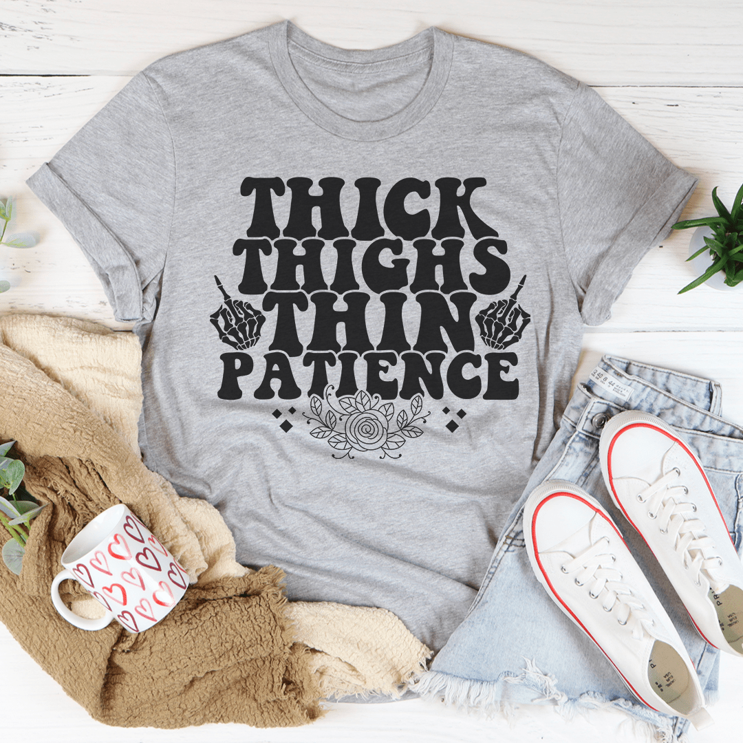 Gray T-shirt with "THICK THIGHS PATIENCE" graphic and crew neckline