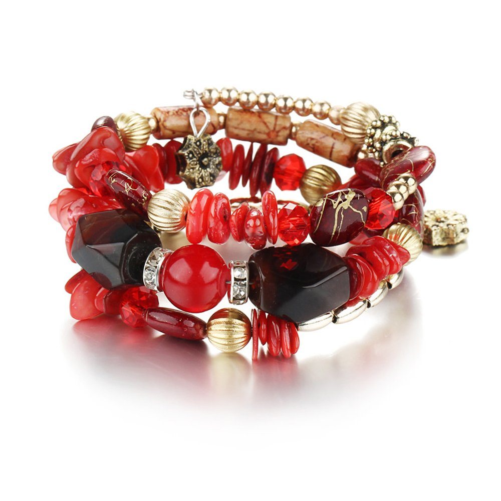 Red and black boho charm bracelet with faceted stones, red crystal beads, and gold-tone charms.