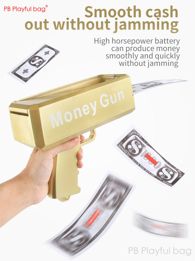 Gold toy money gun held in hand with prop cash bills and swirling silver fake bills