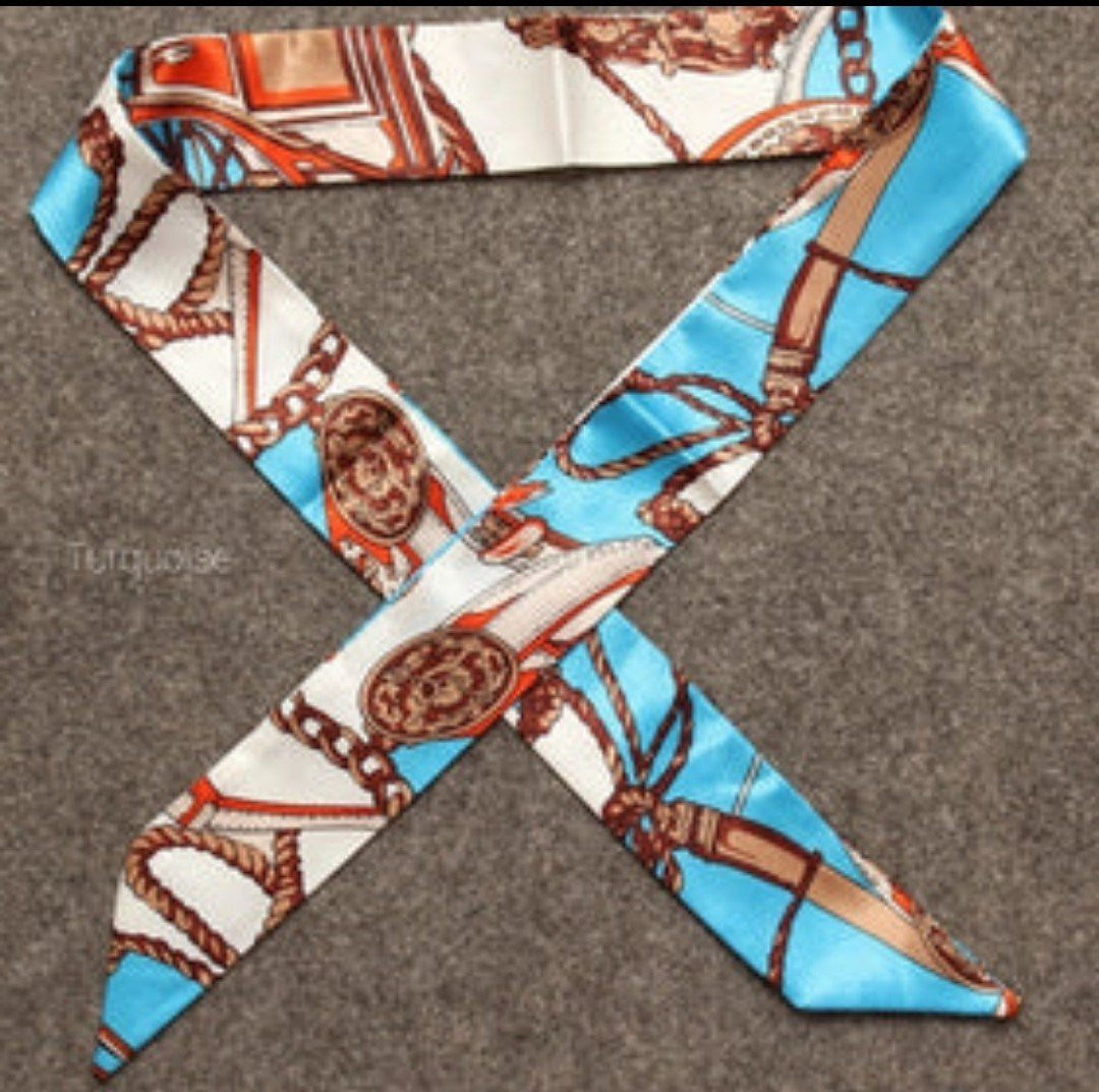 Handbag scarf/neck tie in blue and cream with chain and emblem print, long tie