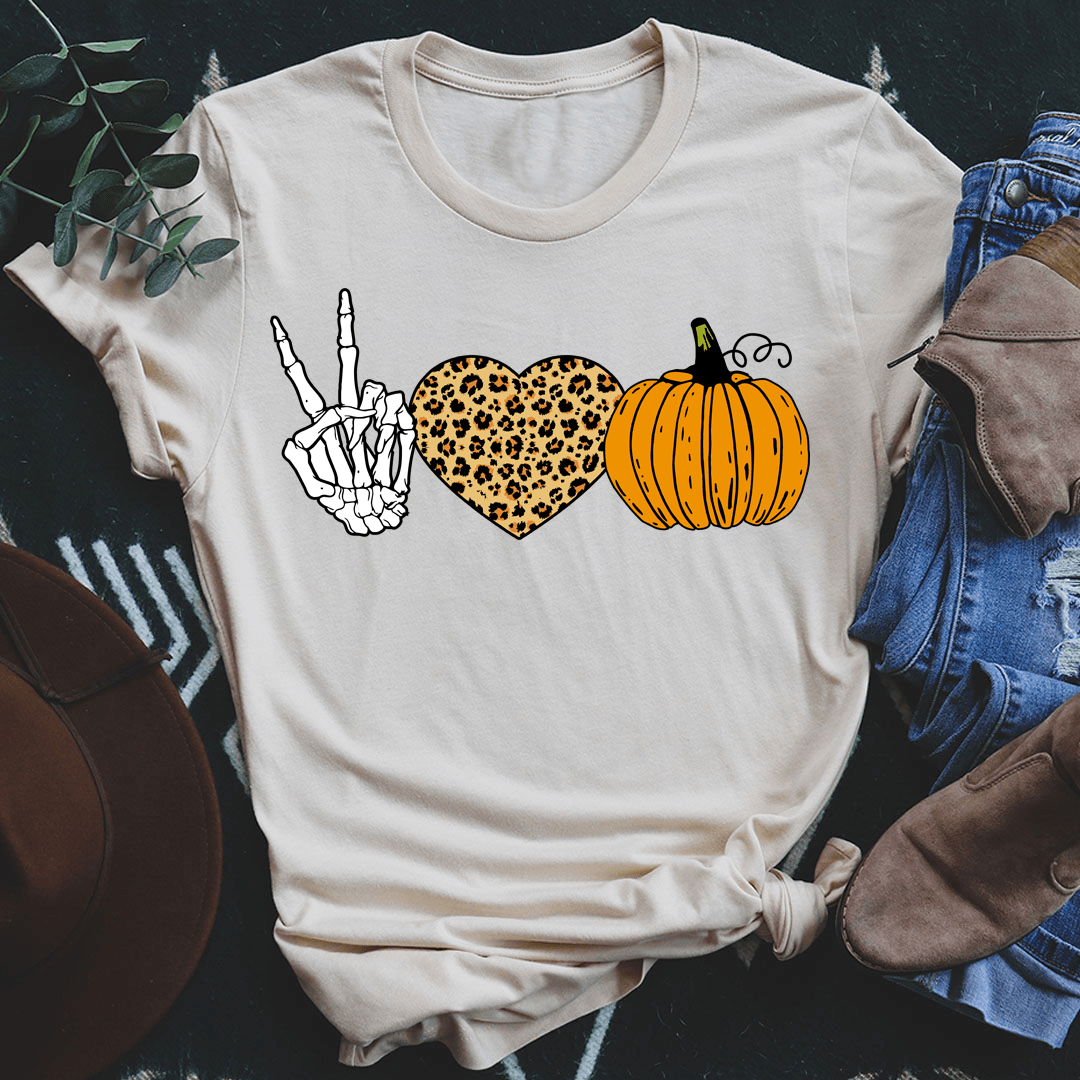 Soft cream T-shirt with peace hand, leopard heart and pumpkin graphic, knotted front hem