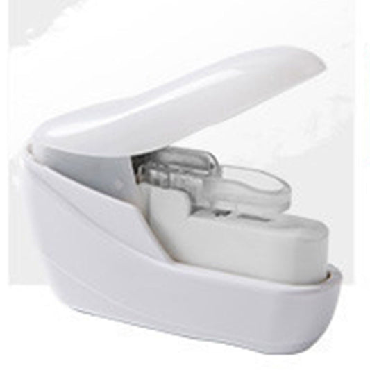 White staple-free handheld stapler, angled close-up of base and release top