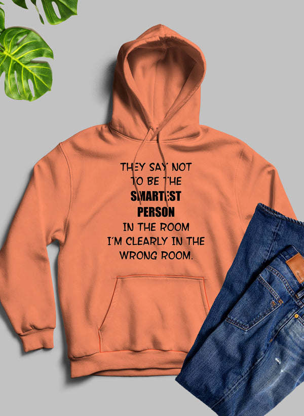 Coral pullover hoodie with hood and front pocket, black printed quote on the chest.