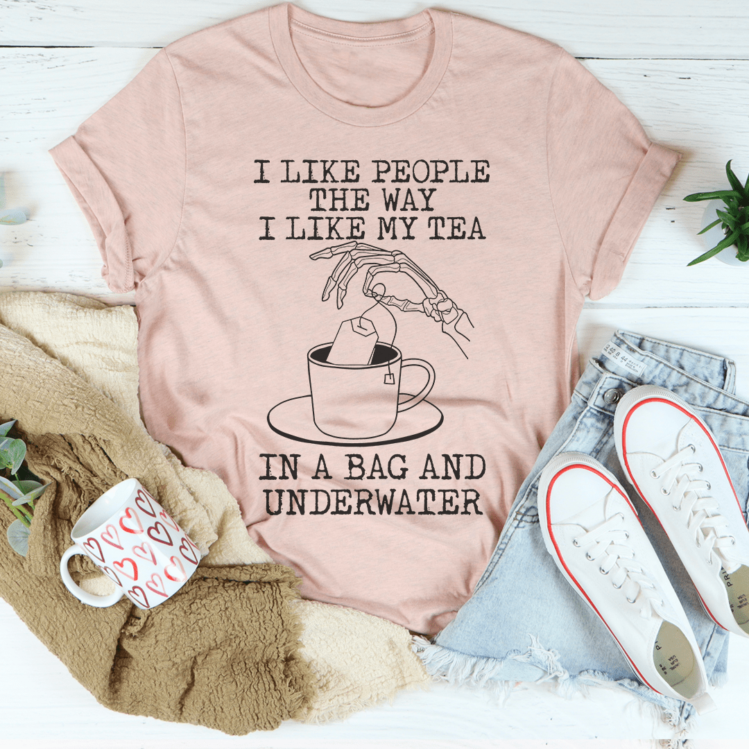 Light mauve T-shirt with 'I like my tea' quote and tea bag underwater illustration.