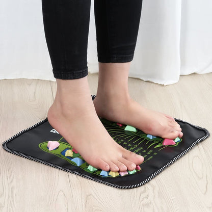 Foot pressure and massage mat under feet with colorful acupressure nodes