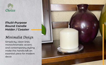 White pillar candle on round metal candle holder/coaster