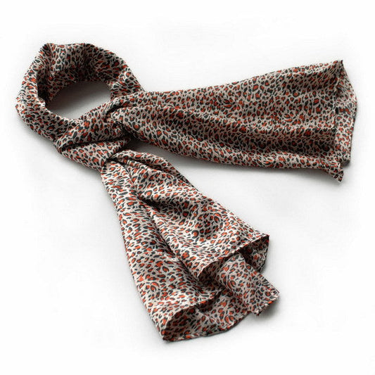 Silk scarf with natural leopard pattern in orange, black, and cream