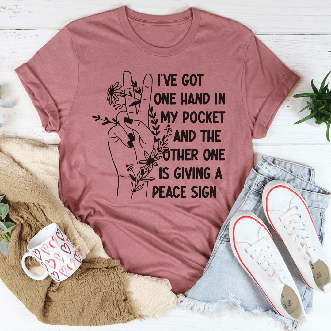 Mauve short-sleeve T-shirt with floral hand-in-pocket peace sign graphic