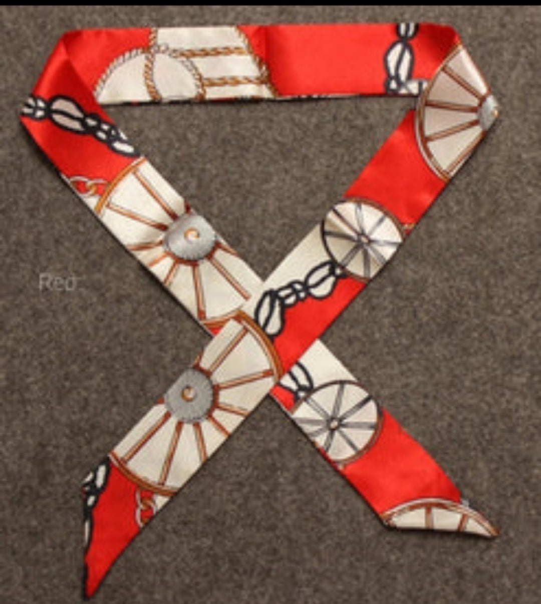 Handbag scarf/neck tie in red with wheel and chain motif print, long tie