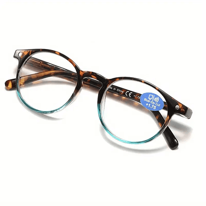 Tortoiseshell round reading glasses with blue temple accents and clear lenses