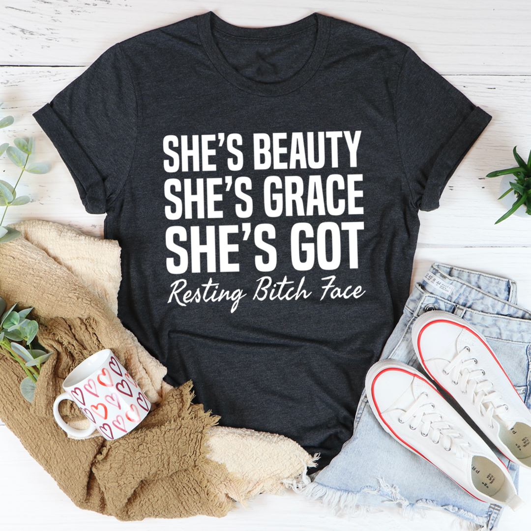 Dark grey crewneck T-shirt with white 'She's Beauty She's Grace' text and 'Resting Bitch Face'.