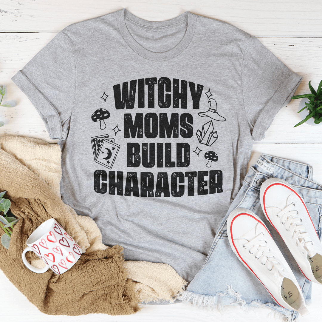 Heather gray graphic t-shirt with witchy slogan 'WITCHY MOMS BUILD CHARACTER'.