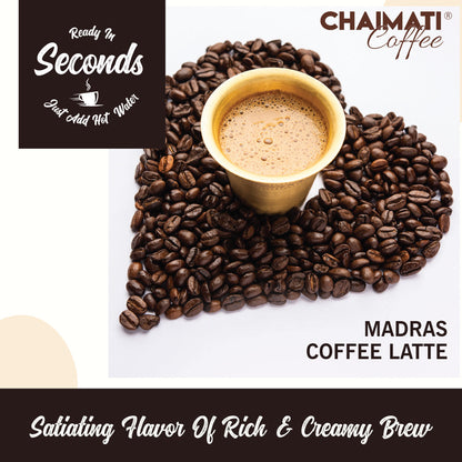 Coffee latte cup with foam, surrounded by whole coffee beans