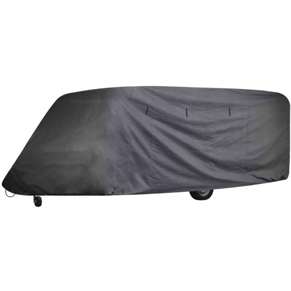 Gray caravan cover draped over travel trailer roof and sides