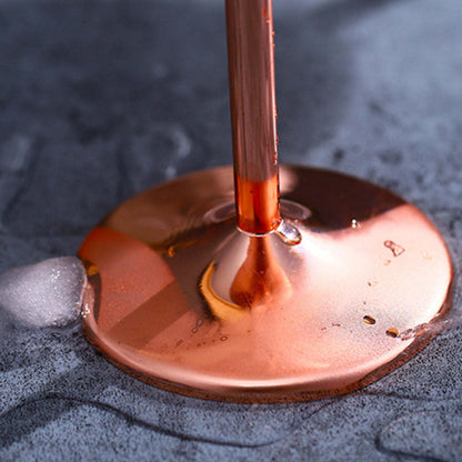 Copper champagne flute with metallic finish and round stemmed base