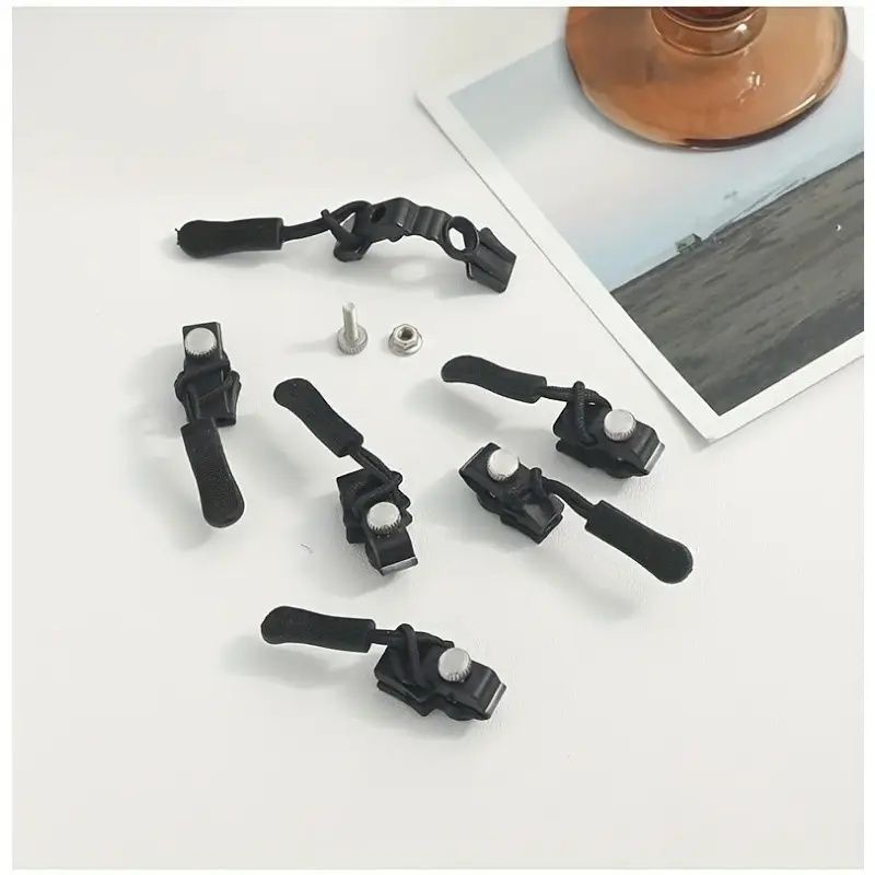 No sew zipper repair kit parts: black tools with metal fasteners