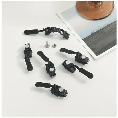 No sew zipper repair kit parts: black tools with metal fasteners