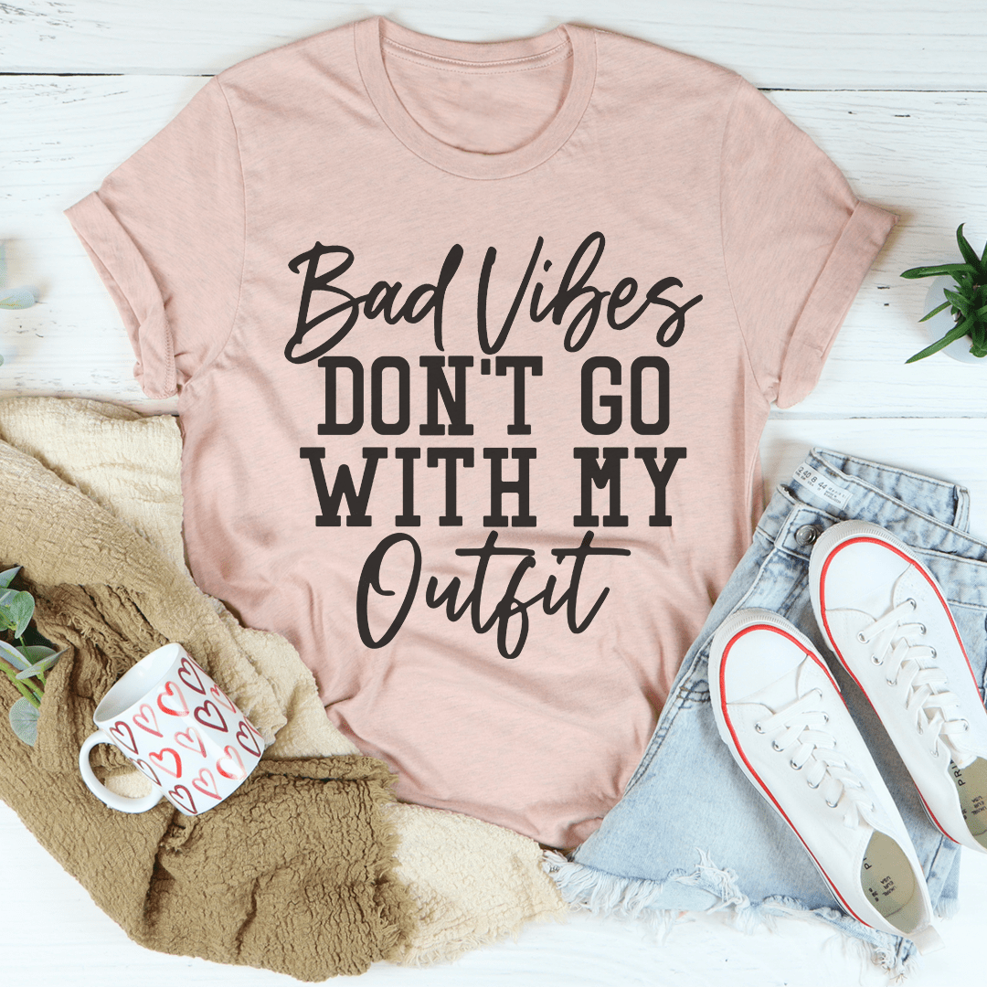 Light pink crew-neck T-shirt with Bad Vibes DON'T GO WITH MY Outfit graphic