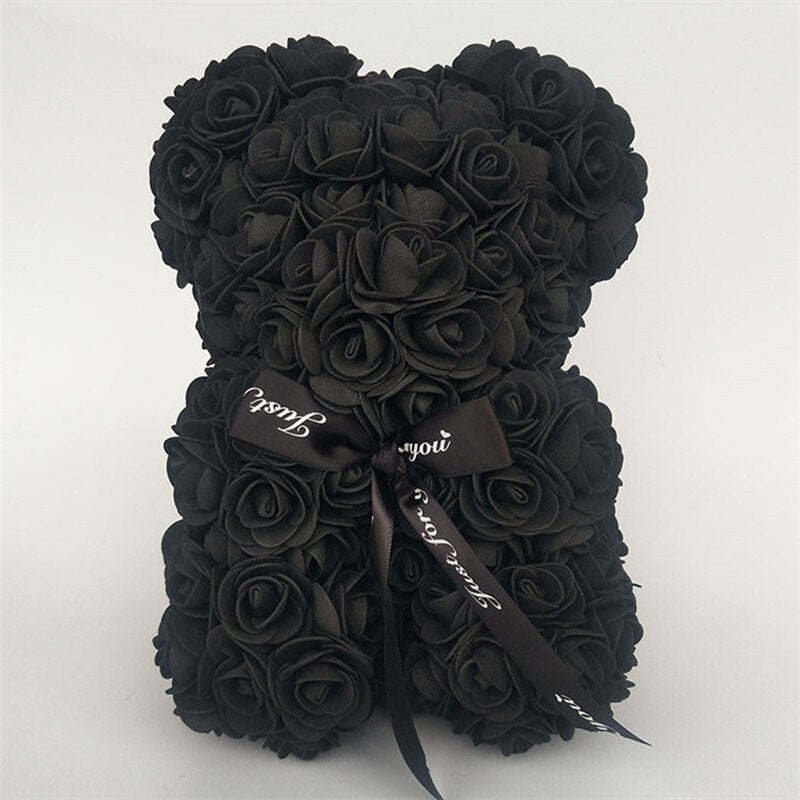 Black rose teddy bear with black bow ribbon tied at the neck