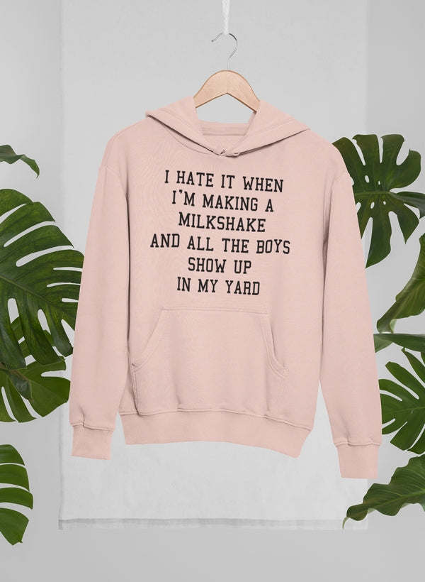 Blush pink pullover hoodie with front text graphic and kangaroo pocket