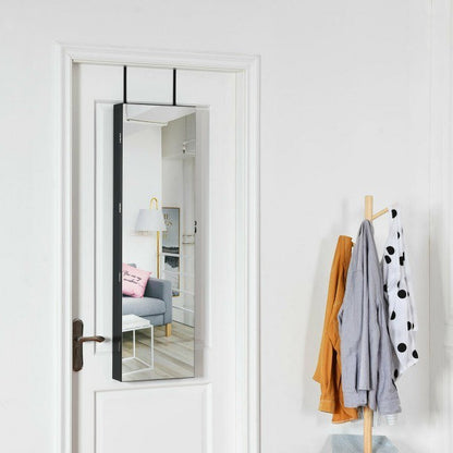 White wall-mounted mirrored jewelry cabinet door with open storage interior