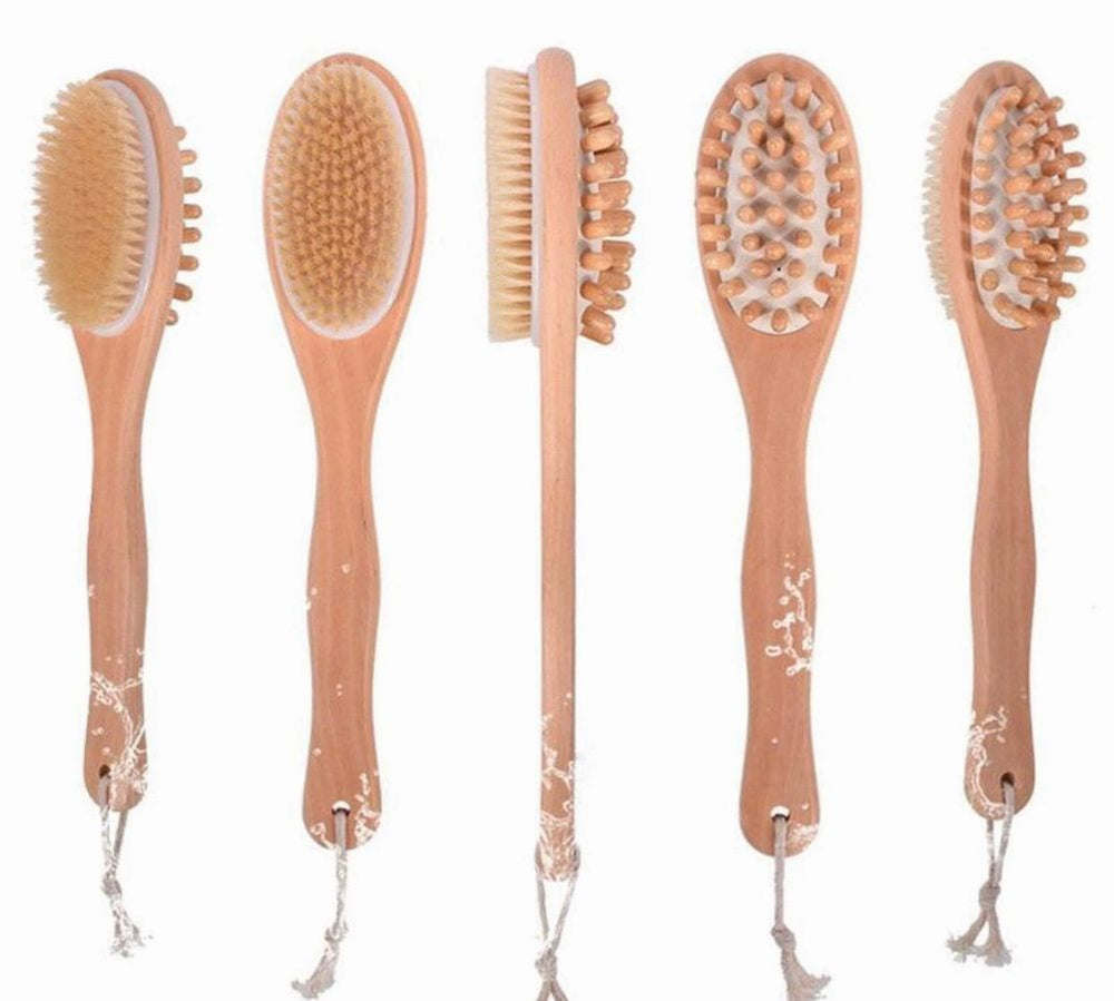 Set of bath body massage brushes with oval heads and tan bristles on wood handles