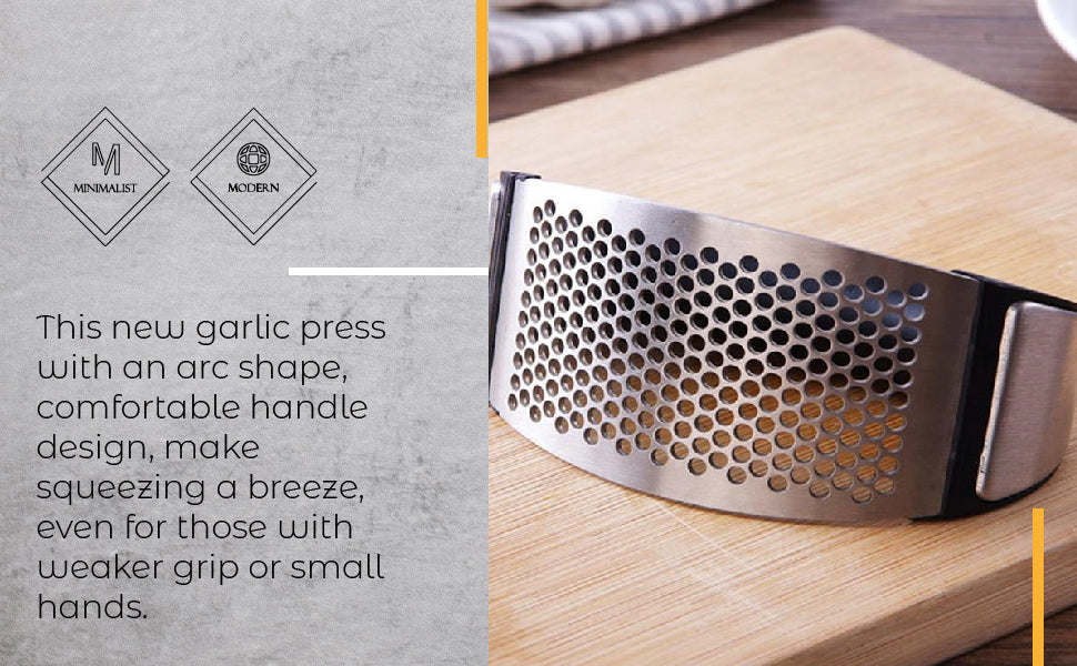 Garlic press on cutting board, with black handle and stainless perforated crushing plate