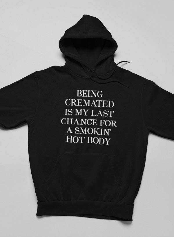Black hoodie with hood up and centered front slogan graphic.