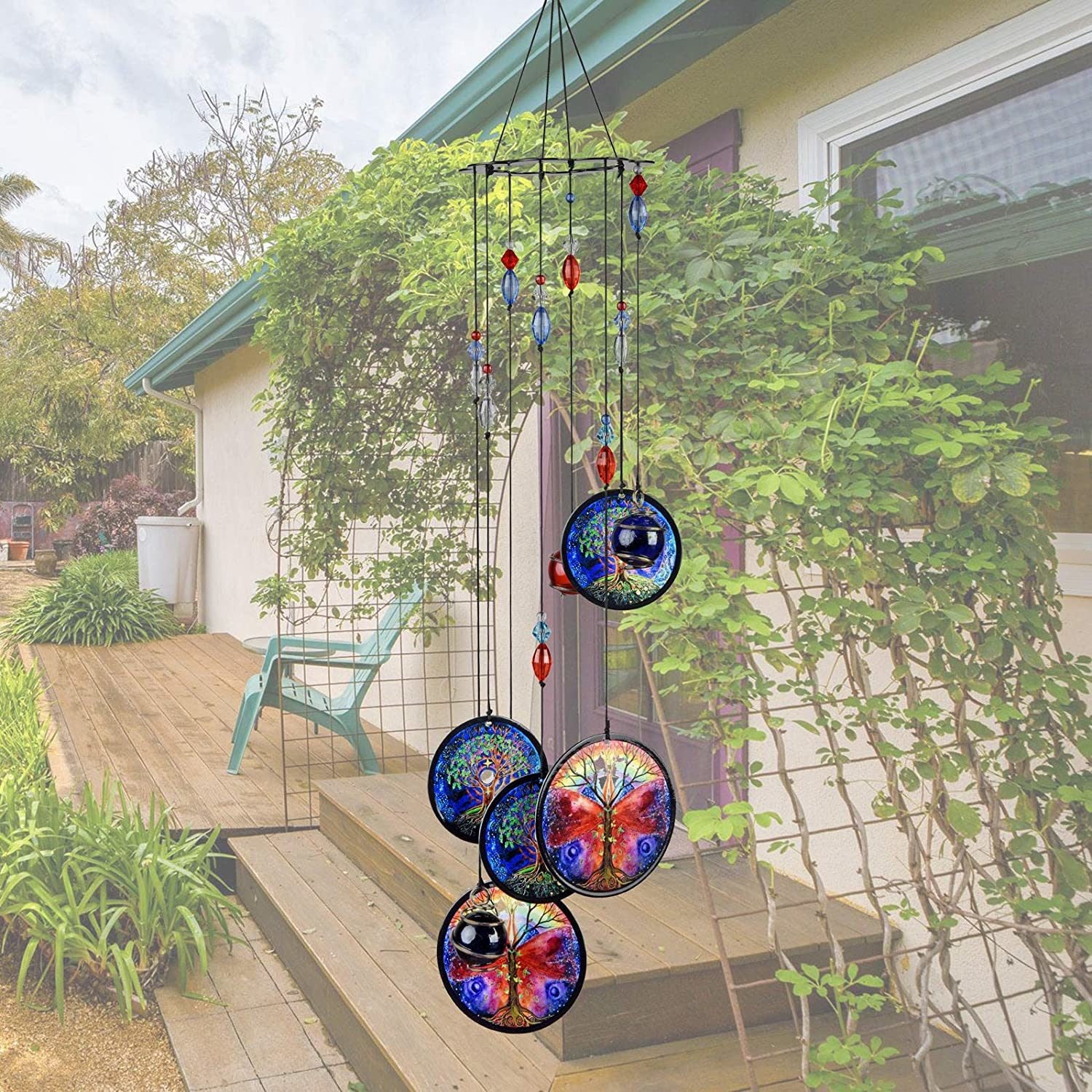 Blue metal wind chime with four round Tree of Life discs and red/blue crystal beads