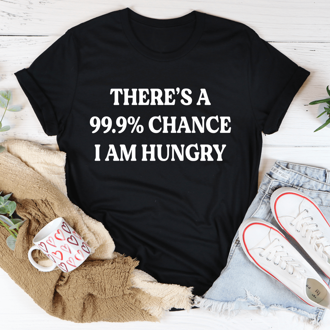 Black heather crew-neck T-shirt with bold centered text: “THERE’S A 99.9% CHANCE I AM HUNGRY”
