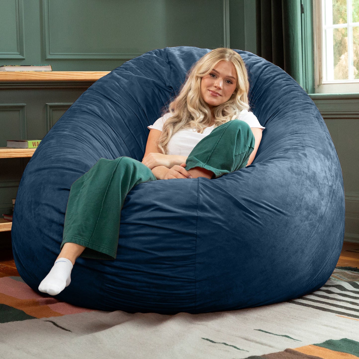 Navy microsuede cocoon bean bag chair with deep curved sides, lounge seat