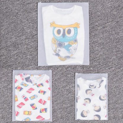 Printed clothing storage covers with owl and candy graphics on cards