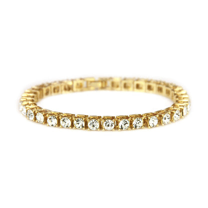 Gold-tone rhinestone tennis bracelet with clear stones and textured gold edges