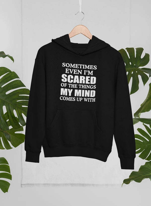 Black hoodie with centered “Sometimes even I’m scared...” text graphic