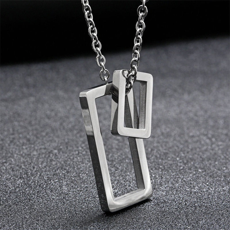 Silver geometric double-rectangle pendant necklace with vertical outline bars
