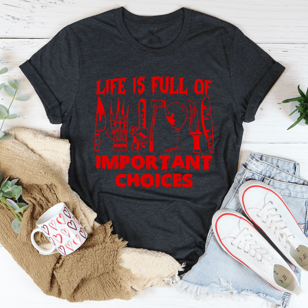 Dark heather crew-neck T-shirt showing large red 'LIFE IS FULL OF IMPORTANT CHOICES' graphic.