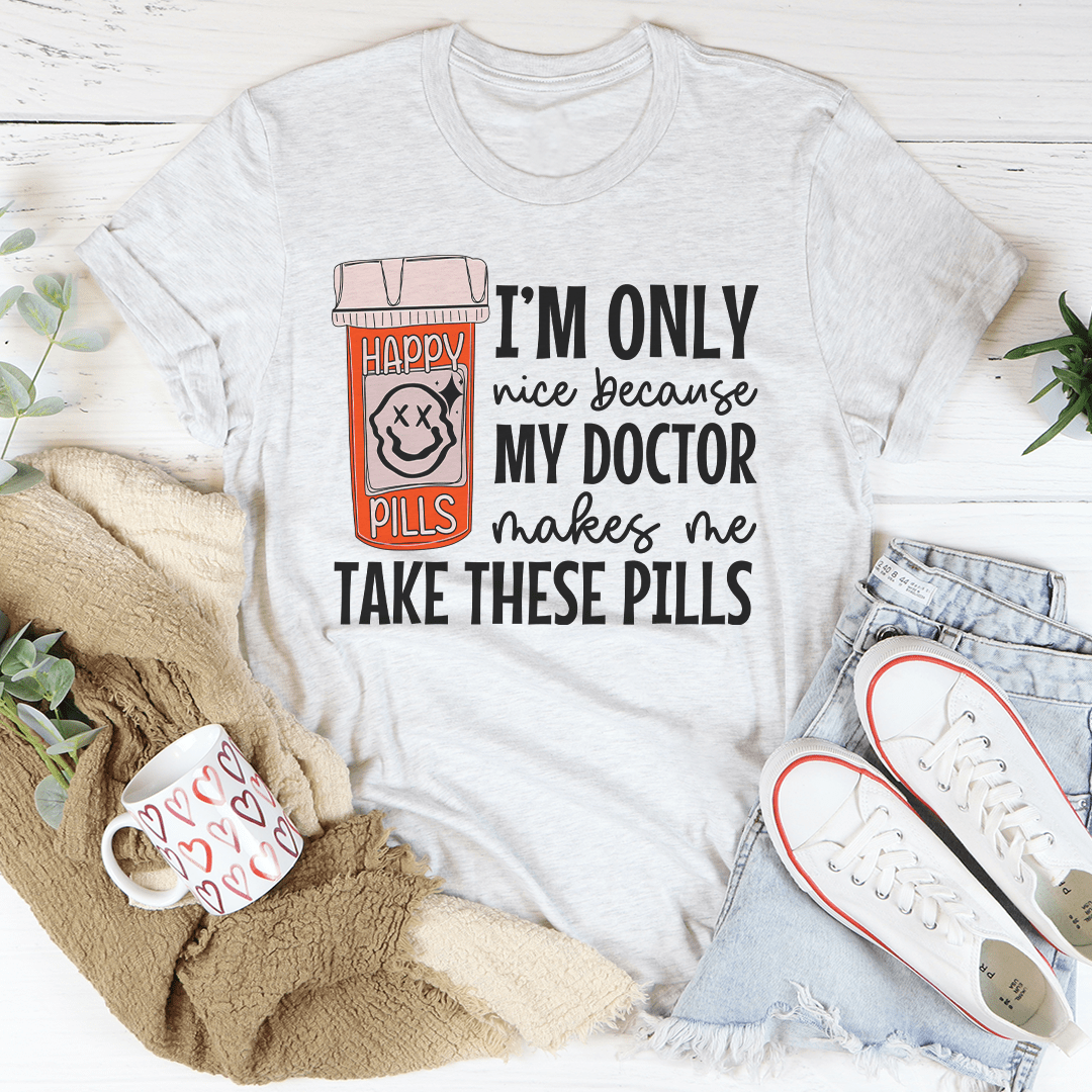 Light gray Happy Pills graphic T-shirt with pill-themed “I’m only nice because my doctor” print