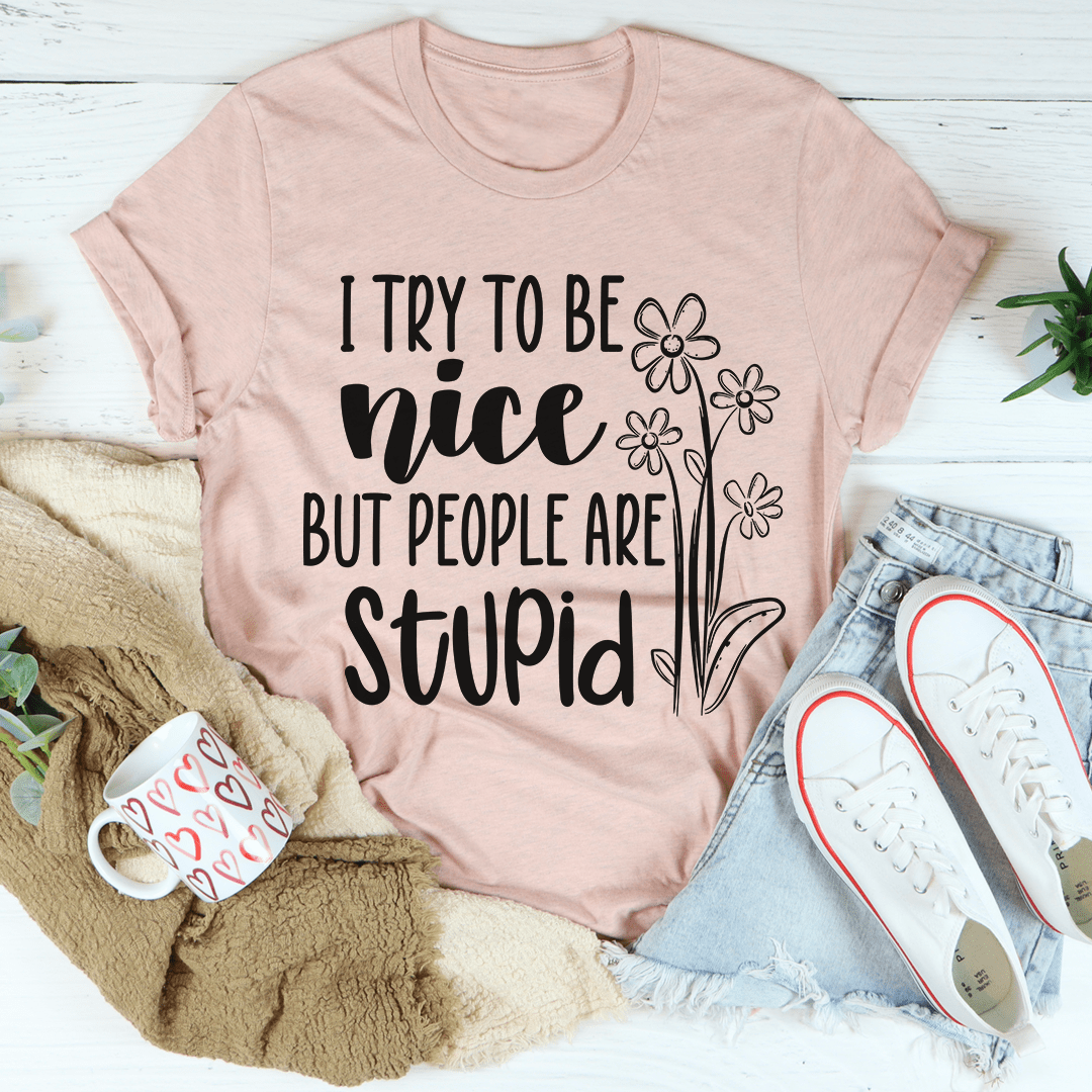 Light mauve T-shirt with black floral text graphic on chest