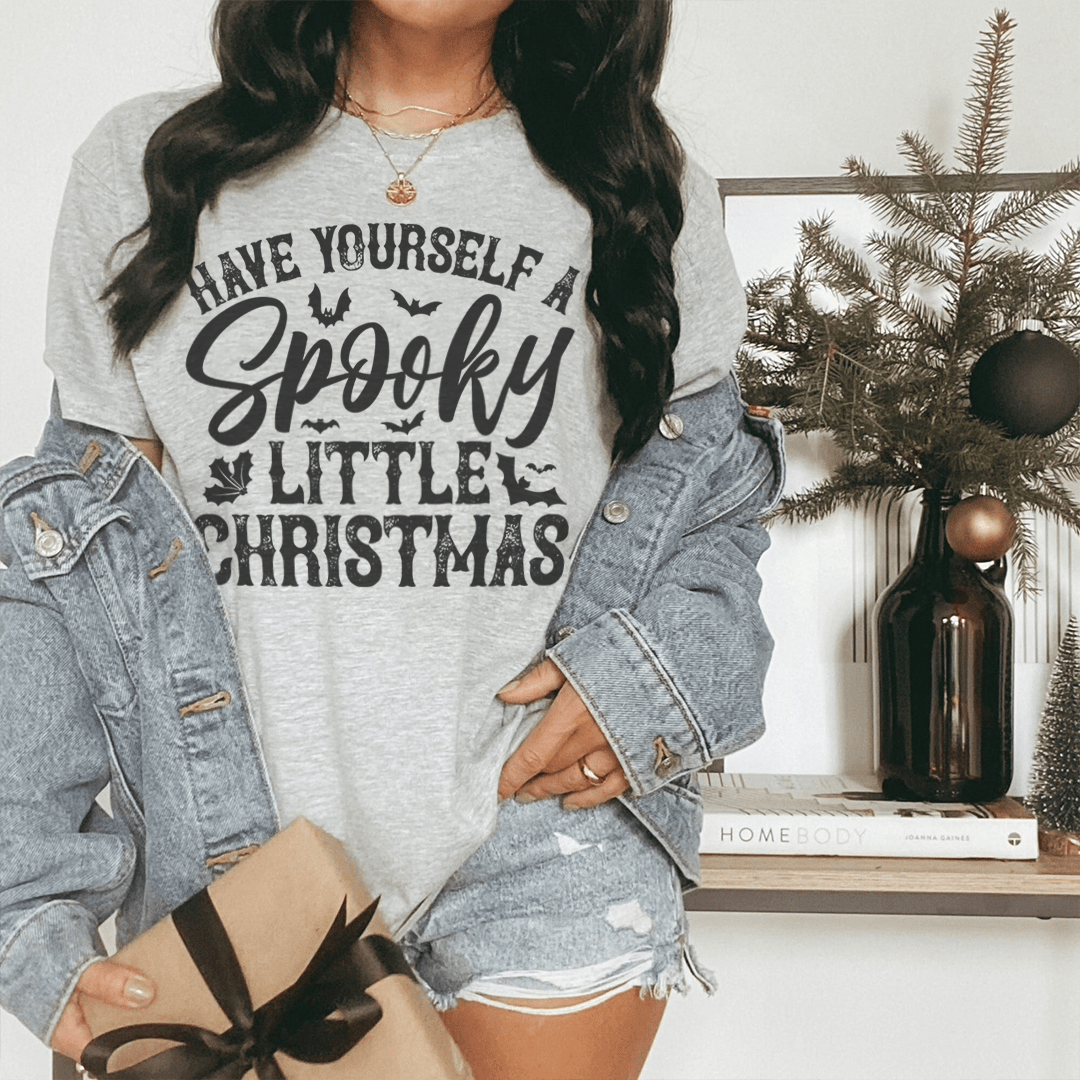 Heather gray T-shirt displaying large spooky Christmas typographic print