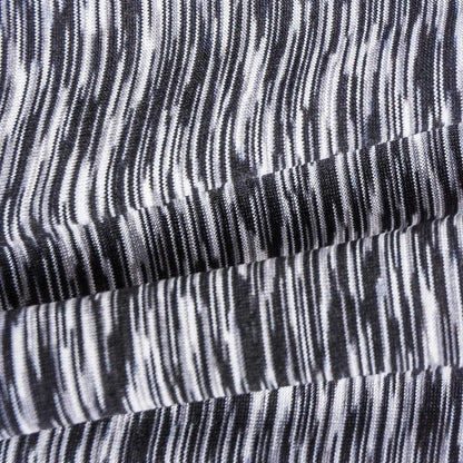 Heathered knit fabric close-up with black and white striped stretch cuffs