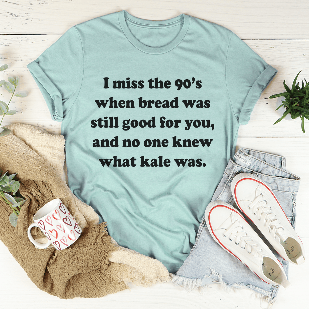 Dusty blue T-shirt with short sleeves and 'I miss the 90's' front slogan text.