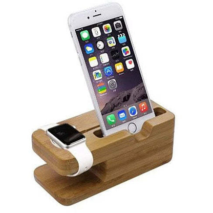 Natural wood charging dock with iPhone in an upright cradle and Apple Watch base slot