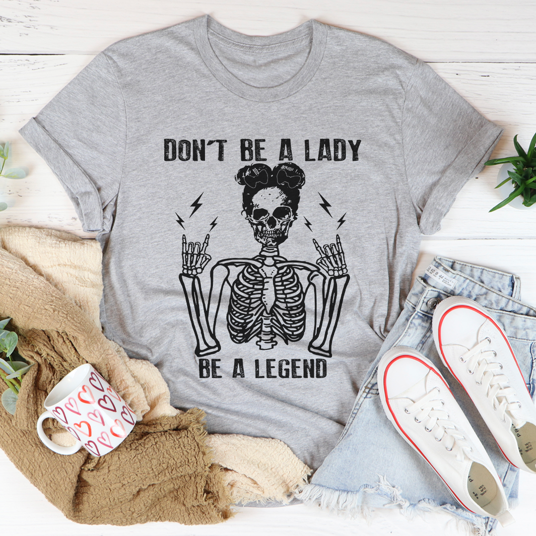 Athletic heather gray T-shirt with skeleton graphic and slogan 'Don't be a lady, be a legend'